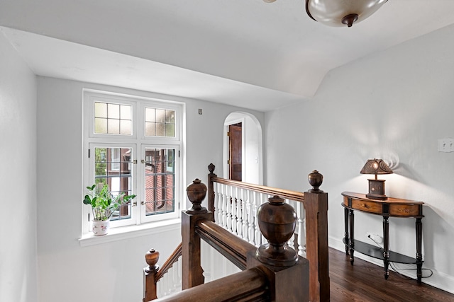 2951 Colfax St, Evanston, IL 60201 - hall with arched walkways, dark wood-type flooring, baseboards, and an upstairs landing