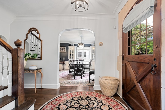 2951 Colfax St, Evanston, IL 60201 - foyer featuring arched walkways, wood finished floors, ornamental molding, healthy amount of natural light, and baseboards