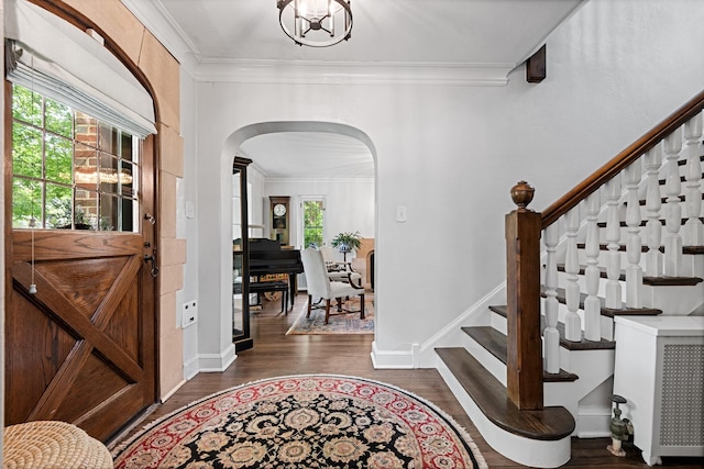 2951 Colfax St, Evanston, IL 60201 - entryway with arched walkways, ornamental molding, dark wood-style floors, stairway, and baseboards