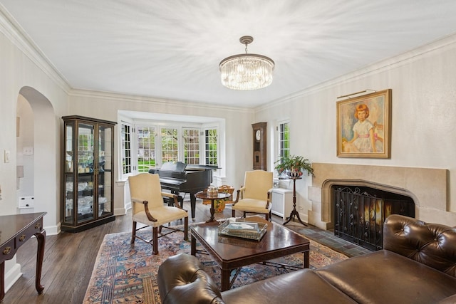 2951 Colfax St, Evanston, IL 60201 - living room with arched walkways, a fireplace with flush hearth, ornamental molding, dark wood finished floors, and a chandelier