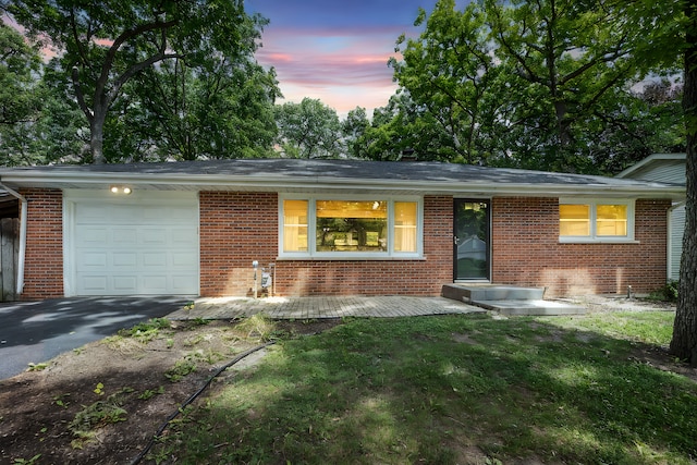 308 Dunbar Rd, Mundelein, IL 60060 - view of front of home with brick siding, a garage, and driveway