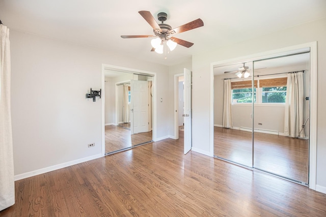 308 Dunbar Rd, Mundelein, IL 60060 - unfurnished bedroom with wood finished floors and a ceiling fan