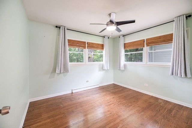 308 Dunbar Rd, Mundelein, IL 60060 - spare room with a baseboard radiator, wood finished floors, and a ceiling fan