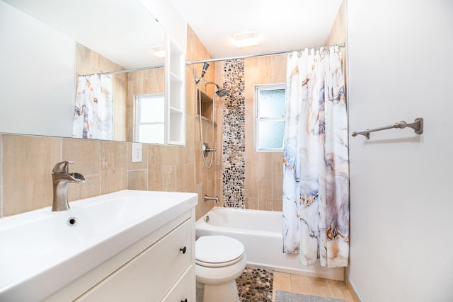 308 Dunbar Rd, Mundelein, IL 60060 - full bath with plenty of natural light, vanity, shower / tub combo, tile patterned floors, and tile walls