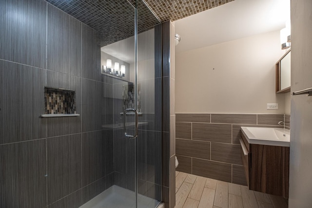 308 Dunbar Rd, Mundelein, IL 60060 - full bath featuring tile walls, vanity, a shower stall, and wood finished floors