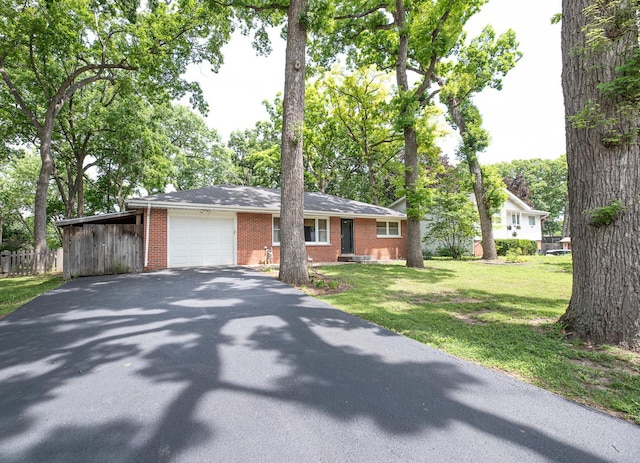 308 Dunbar Rd, Mundelein, IL 60060 - ranch-style house featuring asphalt driveway, brick siding, an attached garage, and a front yard