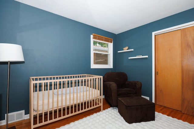103 N Adelaide St, Normal, IL 61761 - bedroom featuring wood finished floors and a closet