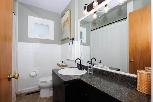 103 N Adelaide St, Normal, IL 61761 - bathroom featuring vanity, tile walls, and a wainscoted wall