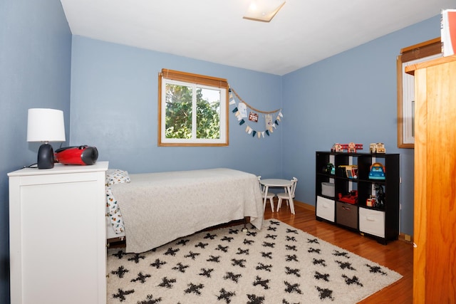 103 N Adelaide St, Normal, IL 61761 - bedroom with wood finished floors and baseboards