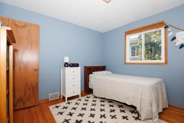 103 N Adelaide St, Normal, IL 61761 - bedroom with wood finished floors and baseboards
