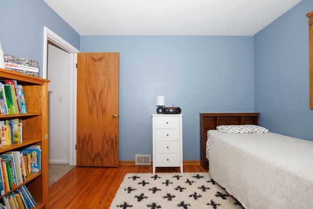 103 N Adelaide St, Normal, IL 61761 - bedroom featuring wood finished floors and baseboards