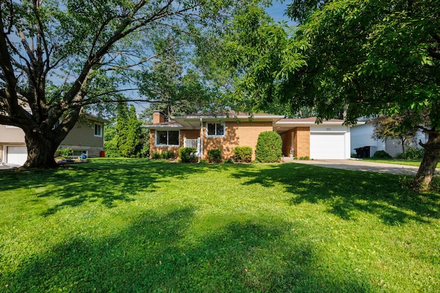 103 N Adelaide St, Normal, IL 61761 - view of front facade with a chimney, driveway, an attached garage, a front lawn, and brick siding
