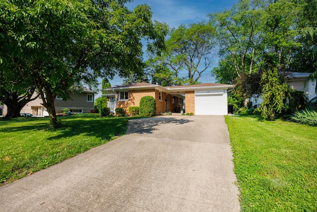 103 N Adelaide St, Normal, IL 61761 - single story home with a garage, concrete driveway, and a front yard