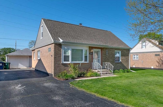 7828 Suburban Ln, Bridgeview, IL 60455 - cape cod-style house with brick siding, an outdoor structure, a front lawn, a detached garage, and roof with shingles