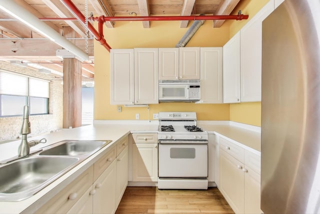 7240 Franklin St Unit 2A, Forest Park, IL 60130 - kitchen with white appliances, light wood-style floors, light countertops, and white cabinetry