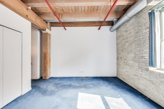 7240 Franklin St Unit 2A, Forest Park, IL 60130 - below grade area featuring brick wall, carpet flooring, wood ceiling, and plenty of natural light