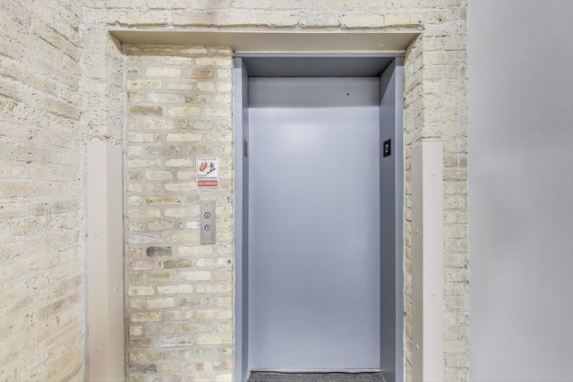 7240 Franklin St Unit 2A, Forest Park, IL 60130 - elevator featuring brick siding
