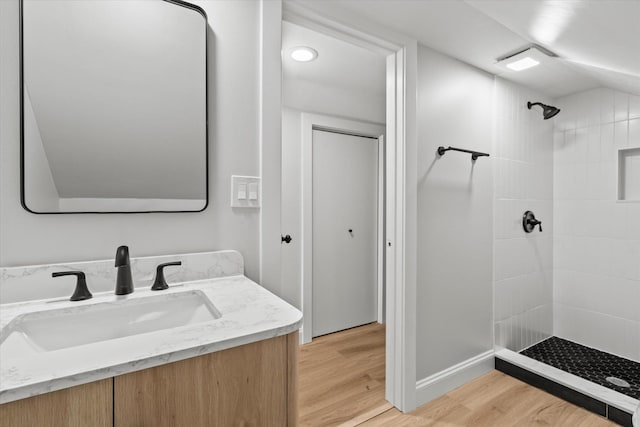 2445 Highland Ave, Berwyn, IL 60402 - full bath featuring a tile shower, wood finished floors, and vanity