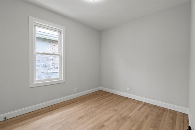 2445 Highland Ave, Berwyn, IL 60402 - empty room with light wood finished floors and baseboards