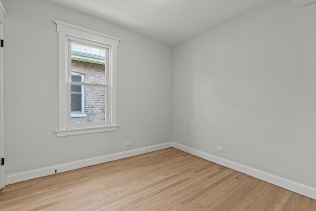 2445 Highland Ave, Berwyn, IL 60402 - spare room featuring light wood finished floors and baseboards