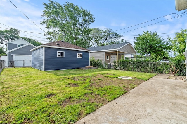 2445 Highland Ave, Berwyn, IL 60402 - rear view of property with a garage, a fenced backyard, and an outdoor structure