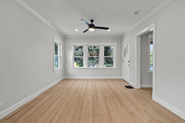 2445 Highland Ave, Berwyn, IL 60402 - empty room with healthy amount of natural light, crown molding, light wood finished floors, a ceiling fan, and recessed lighting