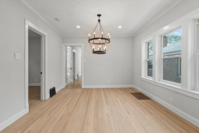 2445 Highland Ave, Berwyn, IL 60402 - unfurnished dining area featuring crown molding, a chandelier, light wood-style flooring, and recessed lighting