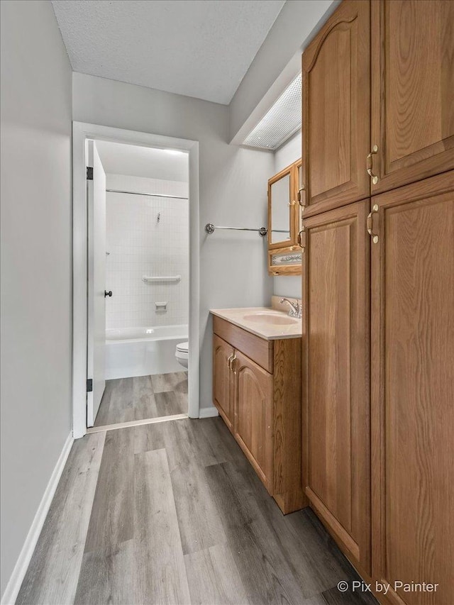 2000 Saint Regis Dr Unit 1D, Lombard, IL 60148 - bathroom with wood finished floors, vanity, and shower / tub combination