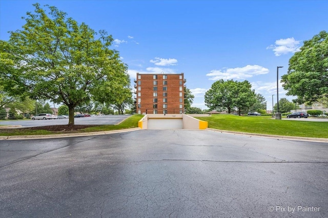 2000 Saint Regis Dr Unit 1D, Lombard, IL 60148 - view of asphalt road featuring curbs