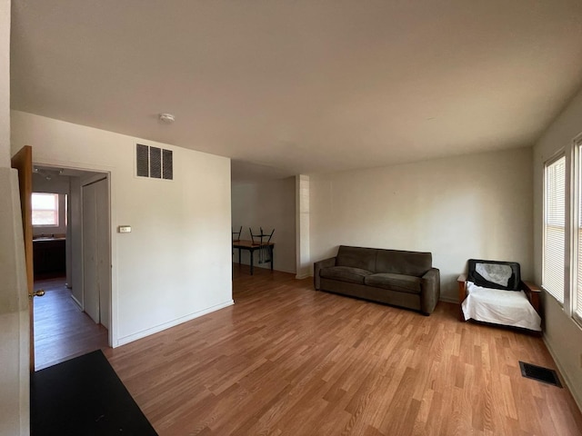1106 Saint Andrews Cir Unit 1, Rantoul, IL 61866 - living room with light wood-style floors and baseboards
