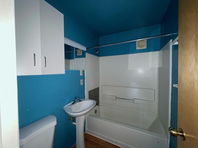 1106 Saint Andrews Cir Unit 1, Rantoul, IL 61866 - bathroom featuring toilet and shower / washtub combination