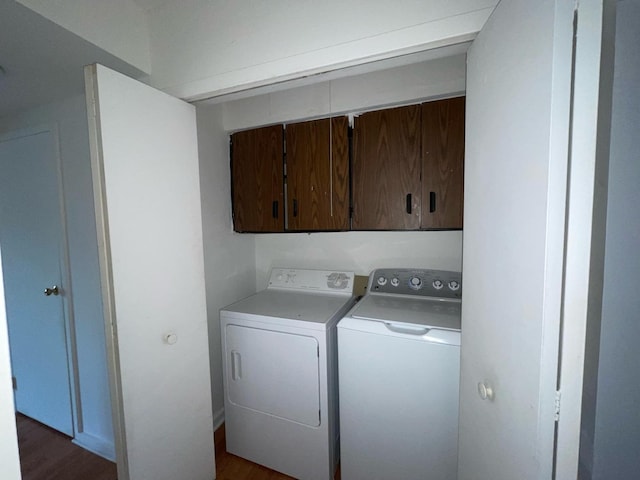 1106 Saint Andrews Cir Unit 1, Rantoul, IL 61866 - laundry room with cabinet space, washer and dryer, and dark wood finished floors