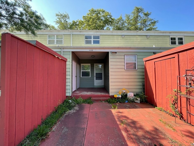 1106 Saint Andrews Cir Unit 1, Rantoul, IL 61866 - rear view of property with a porch