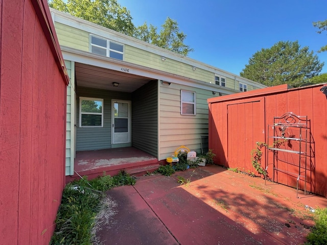 1106 Saint Andrews Cir Unit 1, Rantoul, IL 61866 - view of patio / terrace with a storage shed