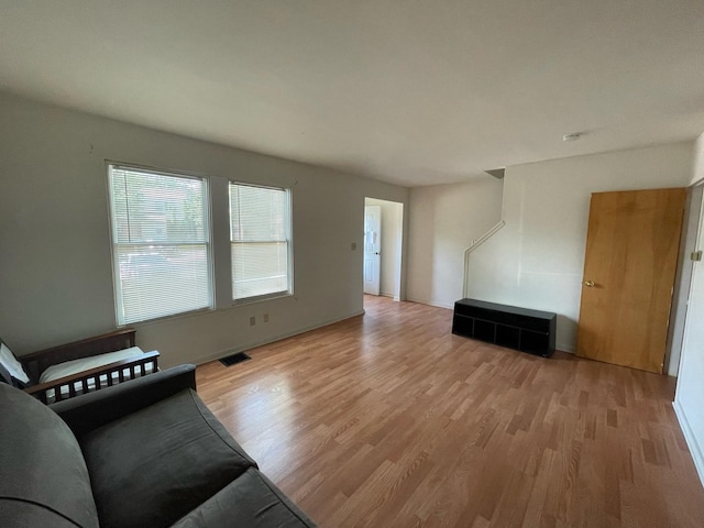 1106 Saint Andrews Cir Unit 1, Rantoul, IL 61866 - unfurnished living room with light wood-style floors