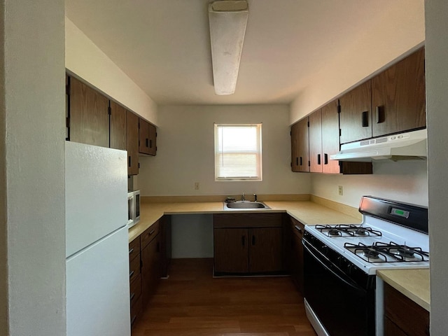 1106 Saint Andrews Cir Unit 1, Rantoul, IL 61866 - kitchen with white appliances, under cabinet range hood, dark wood-type flooring, and light countertops