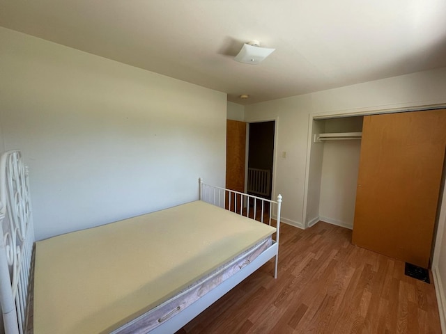 1106 Saint Andrews Cir Unit 1, Rantoul, IL 61866 - bedroom with wood finished floors and a closet