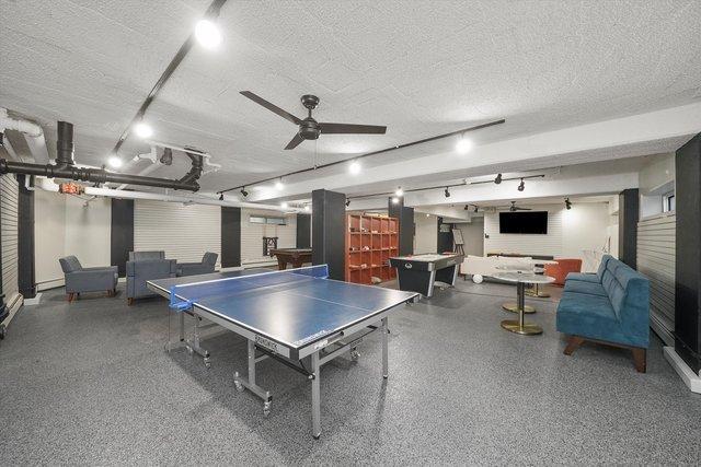 4950 N Marine Dr Unit 1105, Chicago, IL 60640 - playroom featuring a textured ceiling and a ceiling fan