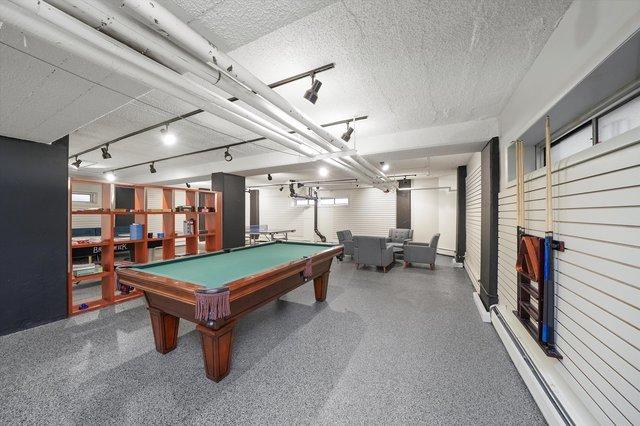 4950 N Marine Dr Unit 1105, Chicago, IL 60640 - recreation room with a textured ceiling and pool table