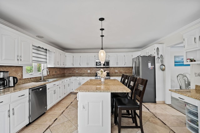 1542 Woodcreek Trl, Bartlett, IL 60103 - kitchen with appliances with stainless steel finishes, tasteful backsplash, white cabinets, light tile patterned floors, and crown molding