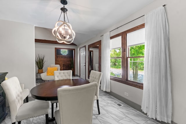 21203 S 93rd Ave, Frankfort, IL 60423 - dining room featuring a chandelier and light marble finish flooring