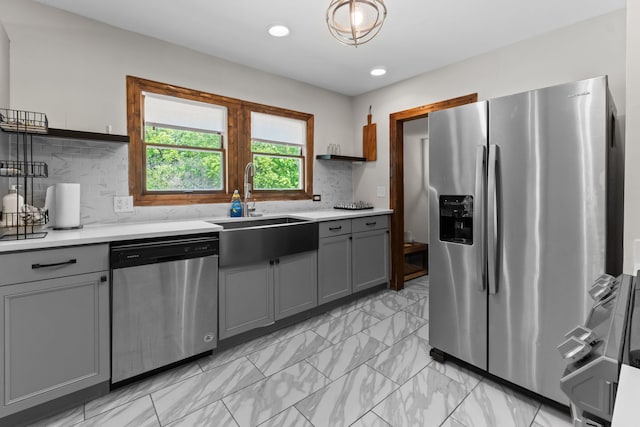 21203 S 93rd Ave, Frankfort, IL 60423 - kitchen featuring appliances with stainless steel finishes, gray cabinetry, light countertops, light marble finish flooring, and recessed lighting