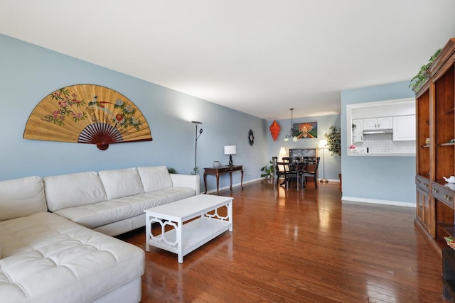 1105 N Mill St Unit 215, Naperville, IL 60563 - living area featuring dark wood-type flooring and baseboards