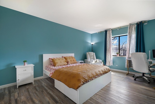 1105 N Mill St Unit 215, Naperville, IL 60563 - bedroom with dark wood-style flooring and baseboards