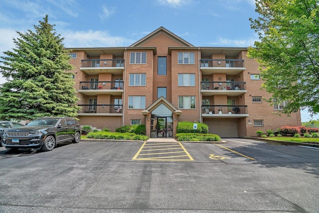 6743 S Pointe Dr Unit 1C, Tinley Park, IL 60477 - view of apartment building / complex featuring uncovered parking