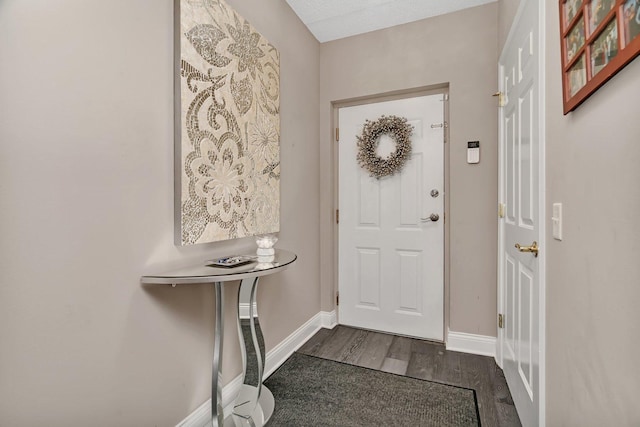 6743 S Pointe Dr Unit 1C, Tinley Park, IL 60477 - foyer entrance featuring dark wood-style floors and baseboards