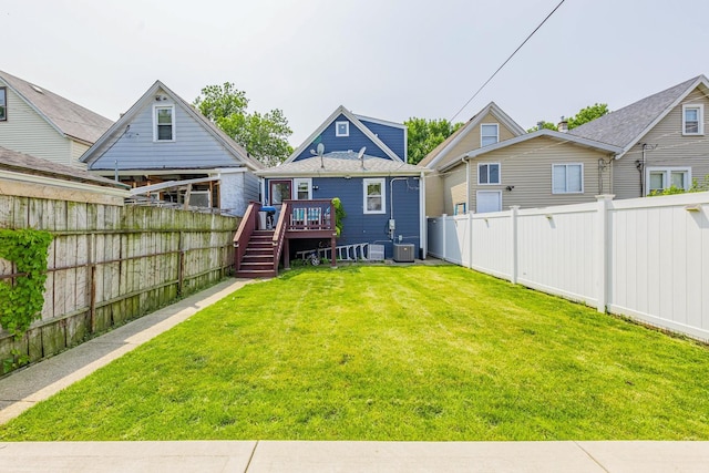 4051 S Rockwell St, Chicago, IL 60632 - rear view of house with a wooden deck, a fenced backyard, and stairs