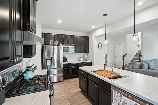 2632 Pecos Cir, Montgomery, IL 60538 - kitchen with appliances with stainless steel finishes, light countertops, recessed lighting, decorative light fixtures, and dark cabinets