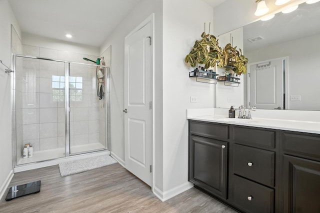 2632 Pecos Cir, Montgomery, IL 60538 - bathroom featuring vanity, a stall shower, wood finished floors, and recessed lighting