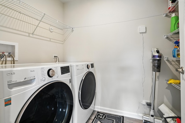 2632 Pecos Cir, Montgomery, IL 60538 - laundry area featuring separate washer and dryer and baseboards